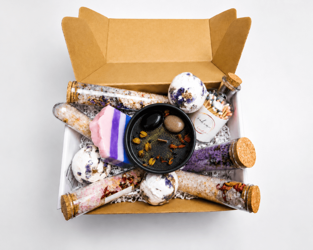 Luxury spa gift box with a Little Black Dress scented soy candle, handmade soap, botanical bath salts, bath bombs and decorative matches.